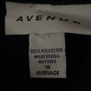 Women’s straight leg, black dress pants with seams.